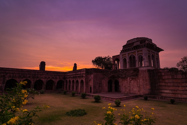 Mandu India, afghan ruins of islam kingdom, mosque monument and muslim tomb. Colorful sky at sunrise, Ashrafi Mahal.