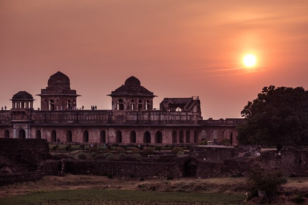 Mandu India, afghan ruins of islam kingdom, mosque monument and muslim tomb. Colorful sky at sunrise.