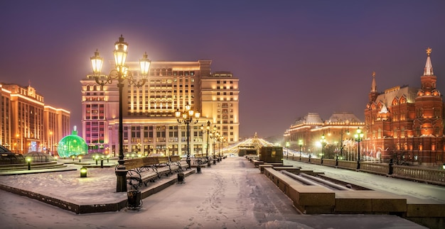 Manezhnaya Square in Moscow and New Year decorations in the light of morning lanterns