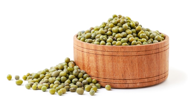 Mang beans in wooden plate close up on white background. Isolated