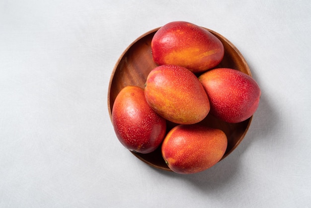 Mango background design concept Top view Diced fresh mango fruit on gray table