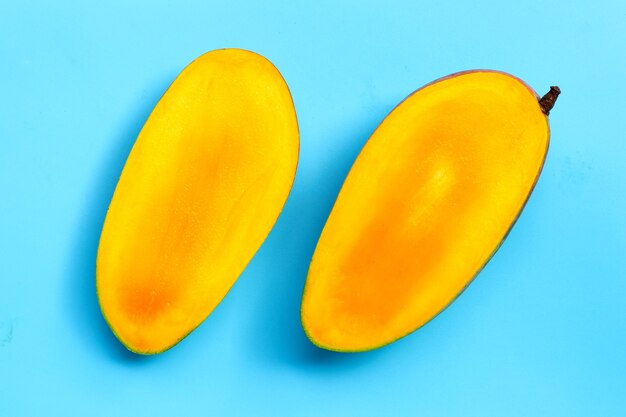 Mango on blue surface