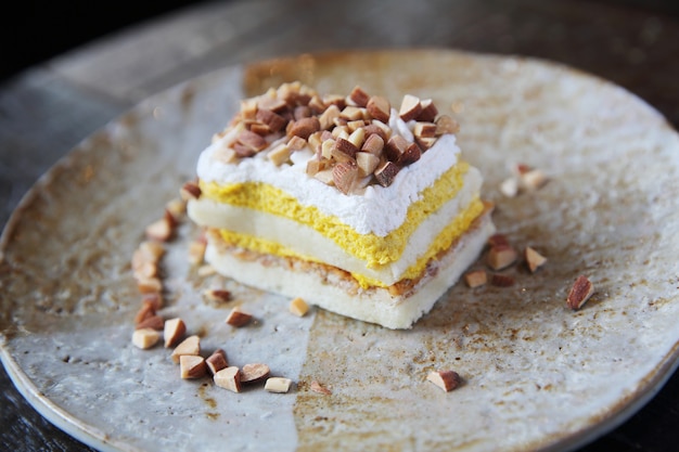 Mango cake with bean on wood background