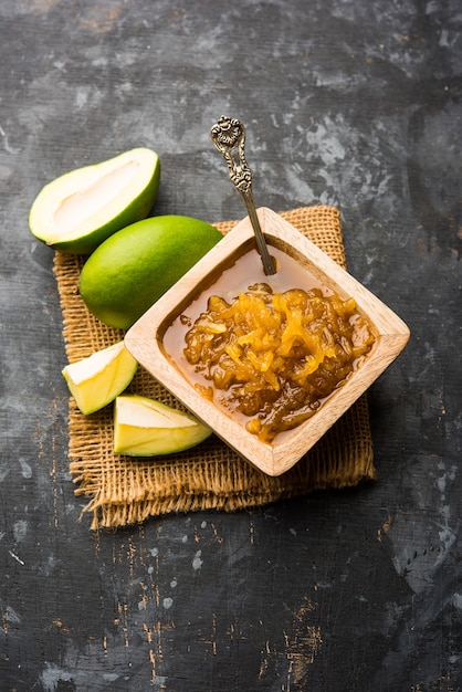 Mango Chunda or Sakhar Amba is a traditional indian summer recipe made using accha aam preserved in sugar syrup for days. selective focus