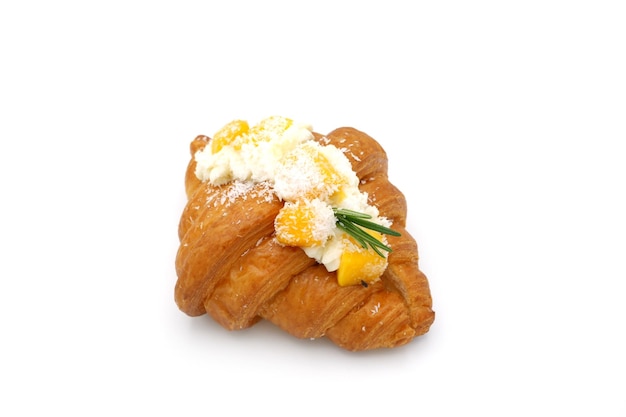 Mango croissant on white background