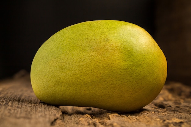 Mango on a dark wood background