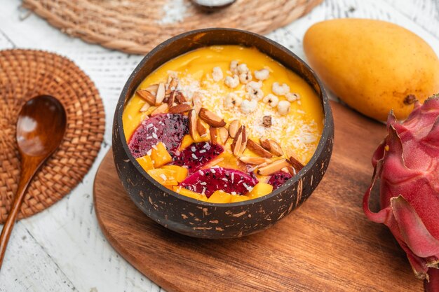 Mango Fruit Smoothie Bowl in Coconut Shell Cup