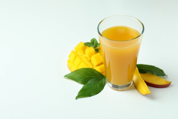 Mango juice and fruit on white background