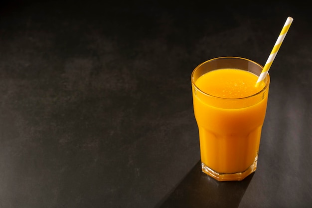 Mango juice in glass cup on the table Mango smoothie