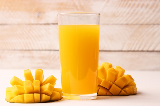 Mango juice in a glass and mango fruit