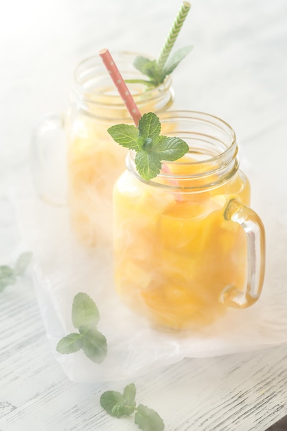 Mango juice in mason jars