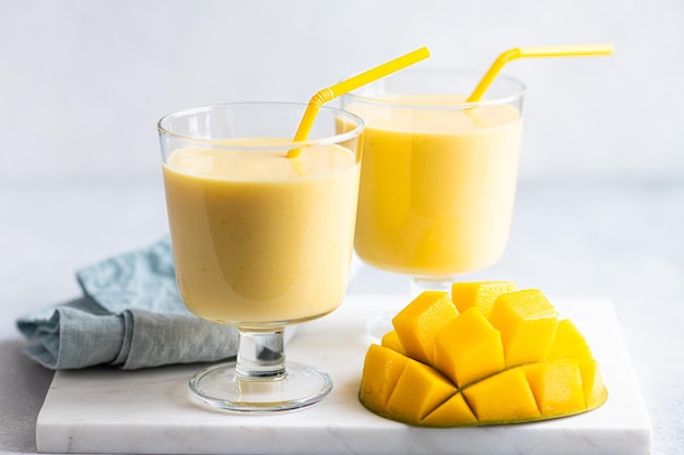 Mango milkshake in a glass selective focus