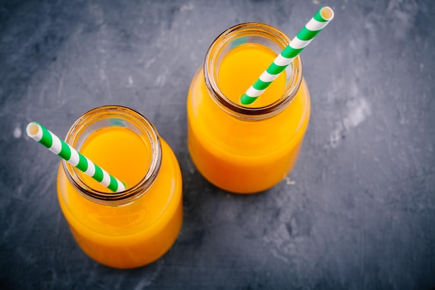 Mango orange juice with ice in glasses