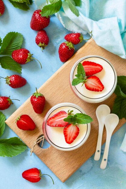 Mango Panna Cotta with jelly and mint strawberries Italian dessert home cooking Top view