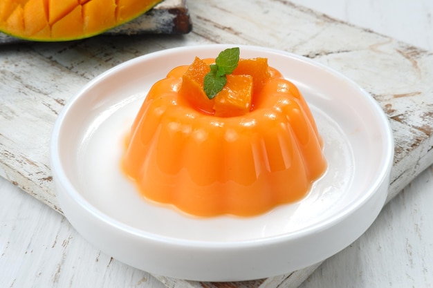 Mango pudding, jelly, dessert on white plate.on white background