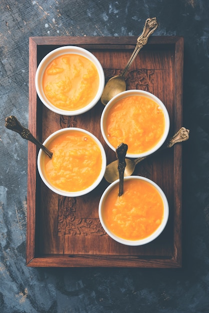 Mango Pulp or Aam rus or Ras served in small bowls, selective focus