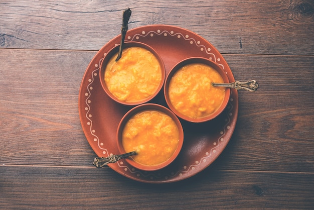 Mango Pulp or Aam rus or Ras served in small bowls, selective focus