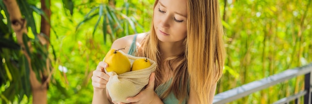 Mango in a reusable bag in female hands zero waste concept plastic free concept healthy clean eating