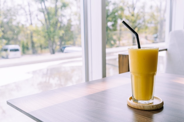 mango smoothie glass in cafe