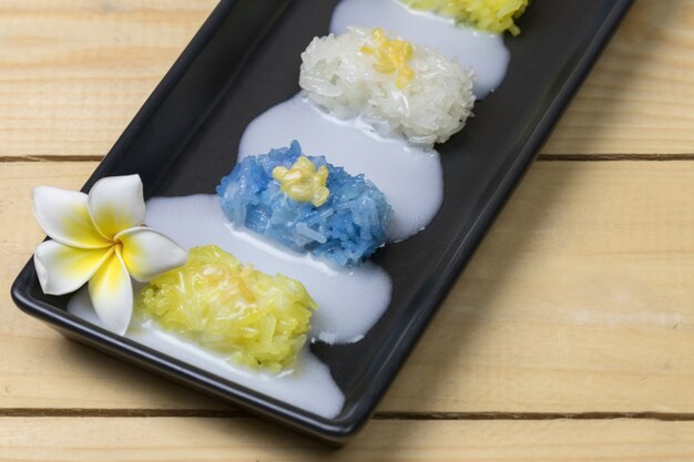 Mango Sticky Rice on wooden table, Thai dessert