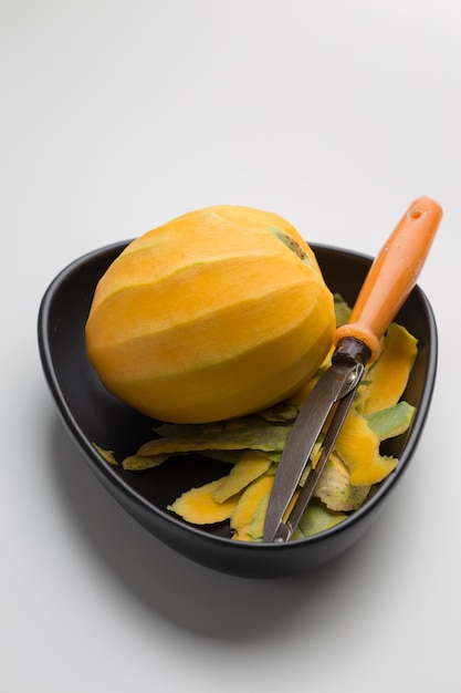 Mangoes peeled and placed in a black dish