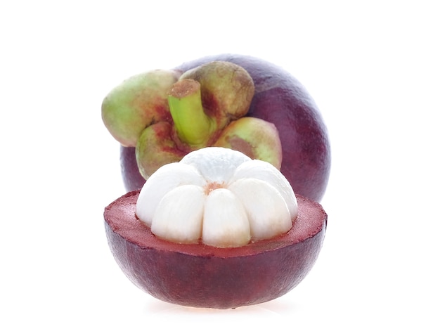 Mangosteen cut half with full balls on white background.