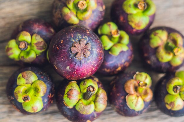 Mangosteen fruit on old wooden table