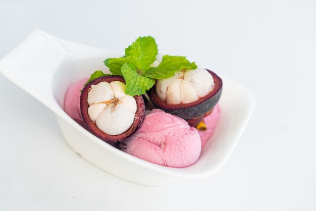 mangosteen ice-cream with fresh mangosteen in white bowl