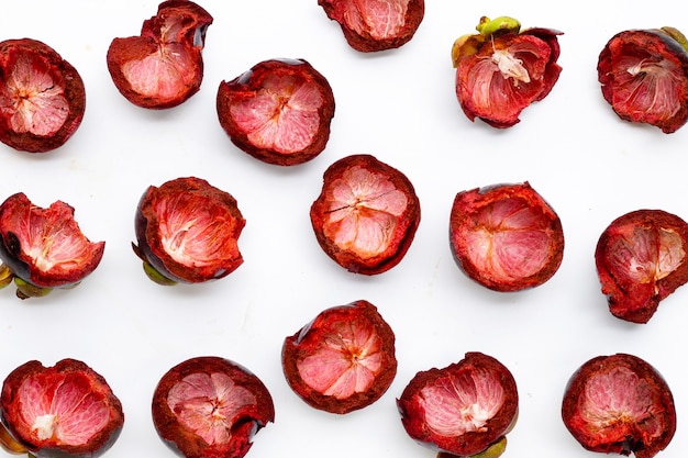 Mangosteen peels on white background. Top view