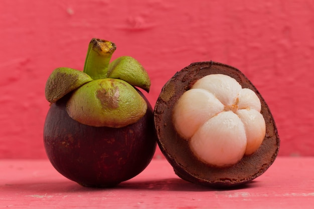 mangosteen on wood pink