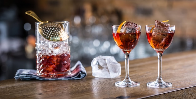 Manhattan cocktail drink decorated on bar counter in pub or restaurant.