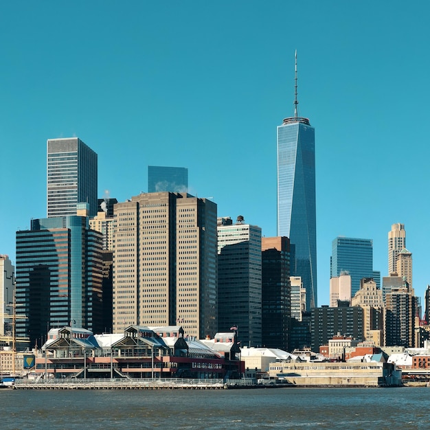 Manhattan downtown skyline with urban skyscrapers over river.