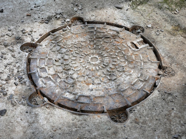 Manhole grunge stijl achtergrond grond close view foto