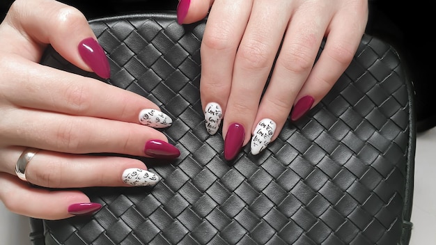 Manicure and nail extension with acrylic and gel the design is\
made with reflective gel polishes