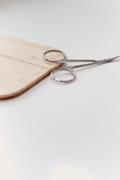 Manicure scissors resting on a wooden board an artistic composition capturing the essence