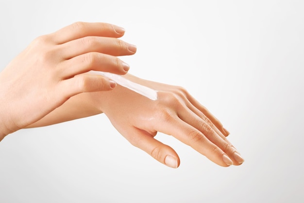 Manicured hands with moisturizerHand lotion