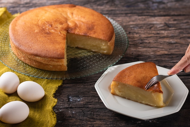 Manioc cake with rustic wood background.