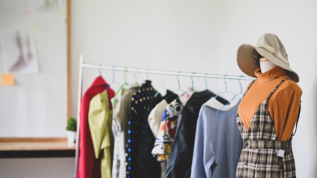 Mannequin dummy model on fashion designer workspace.