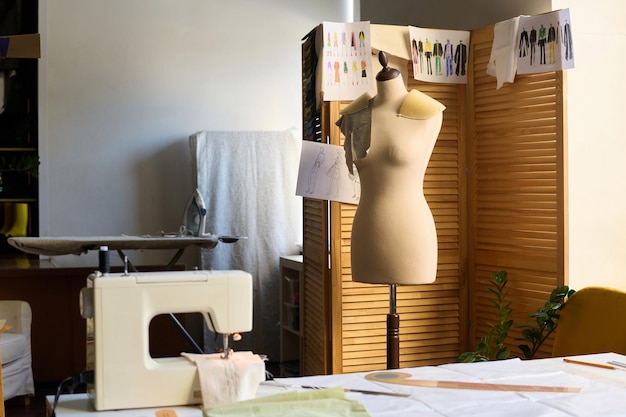 Mannequin and sewing machine in atelier