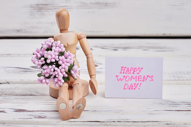 Mannequin with flowers Enjoy international Womens day