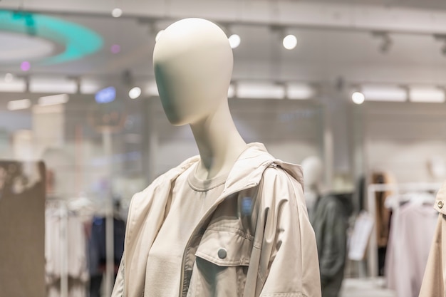 Mannequins in the window of a clothing store. Demonstration of the new collection.