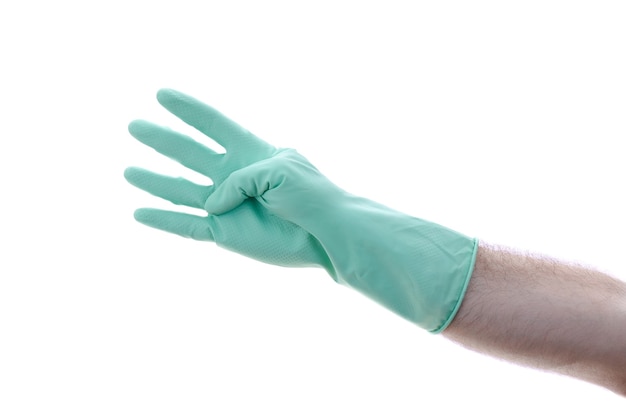 Mans hand in a green glove on hand shows four, isolated on a white background.