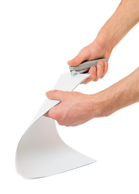 Mans hands tie stapler paper