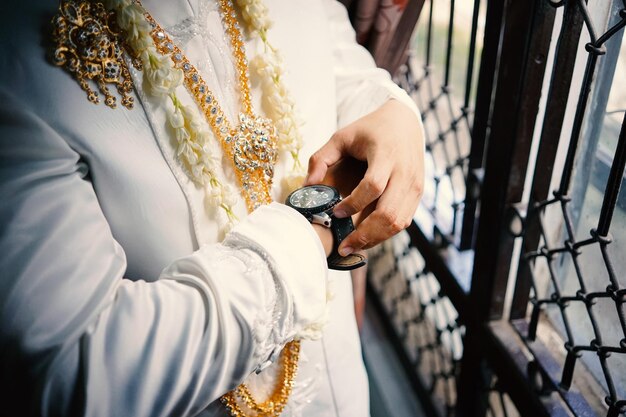 Photo mans watch on hand wedding ceremony