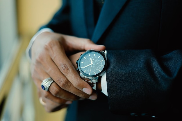 Mans watch on hand Wedding ceremony