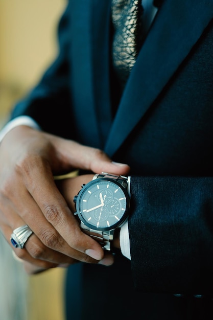 Mans watch on hand Wedding ceremony