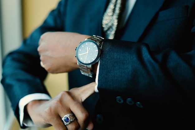 Mans watch on hand Wedding ceremony