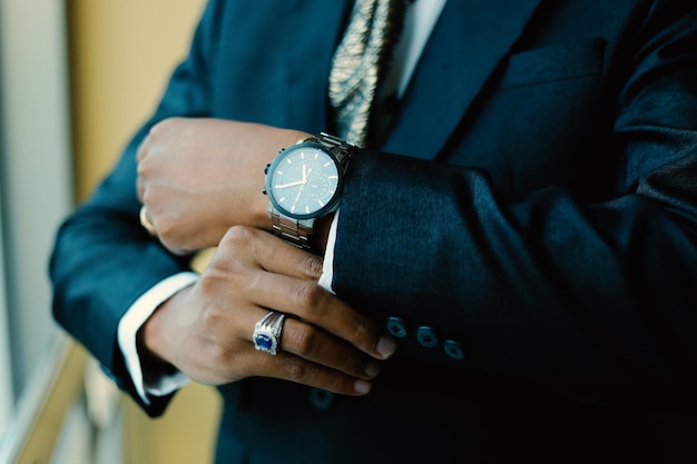 Mans watch on hand Wedding ceremony