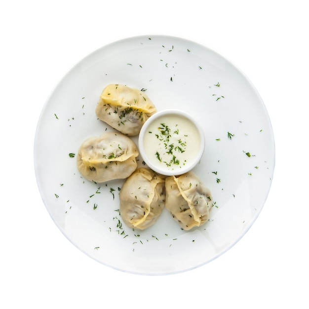 Manti in a plate on a white background.  Top view. Isolated