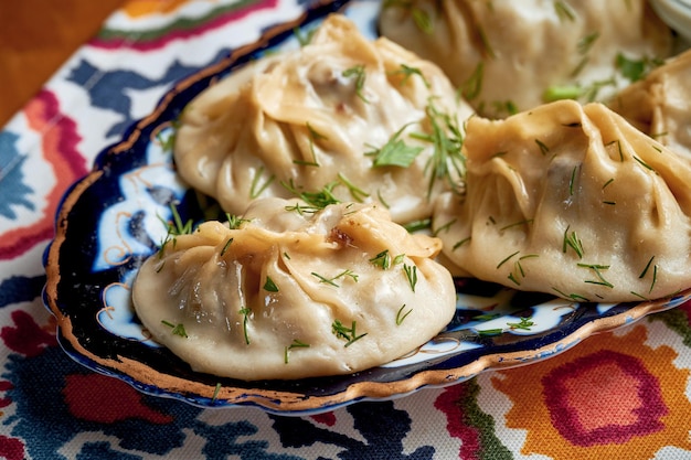 Manti - a type of dumplings stuffed with meat and served on a plate